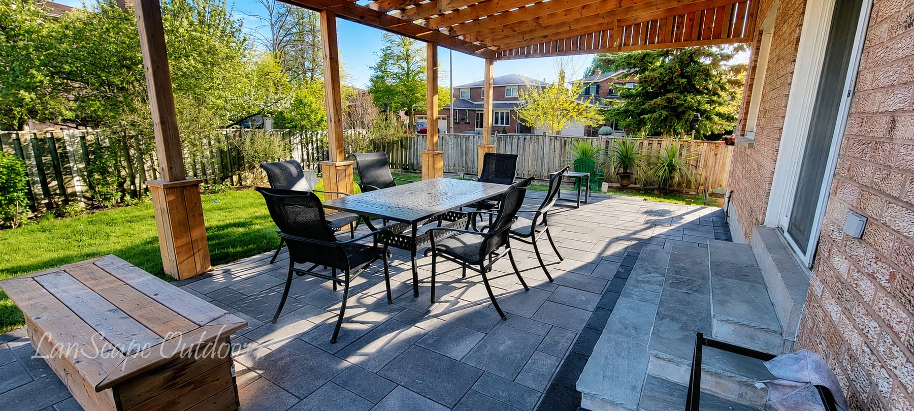Completed Markham backyard interlocking patio and outdoor dining area